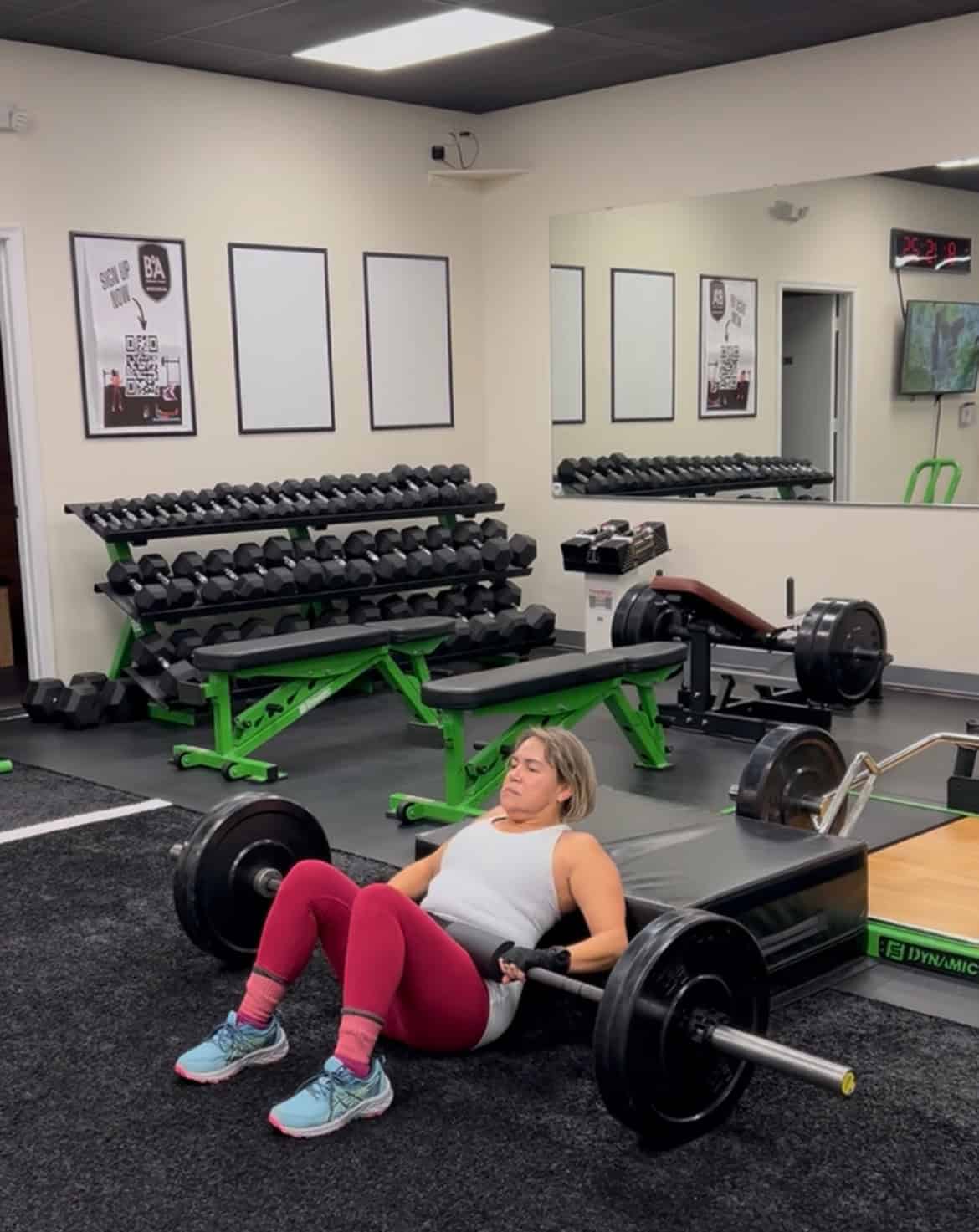 Coach guiding member through mobility stretch